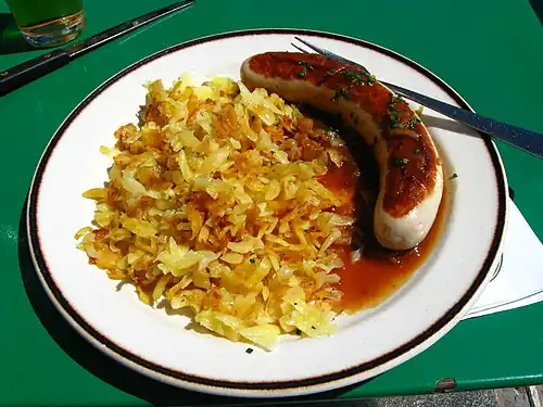 Rösti with veal sausage and onion sauce[2]