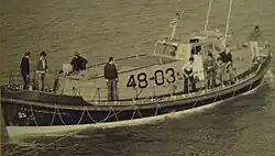 RNLB Ruby and Arthur Reed (ON 990). A photograph of the lifeboat taken during a launch from Cromer Station