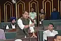 Pathania speaking in J&K Legislative Assembly in March 2025. Daleep Singh Parihar, MLA Bhaderwah on his right and Narinder Singh Raina, MLA Jammu South in his background.