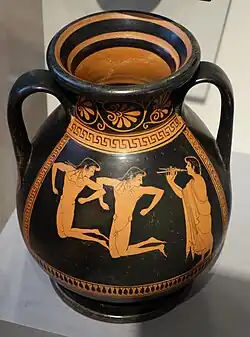 Vase with two handles: two nude men jump in synchronised fashion while a clothed man plays a double flute.