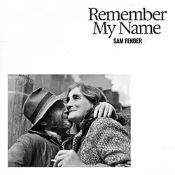 Single cover for "Remember My Name" by Sam Fender, featuring the song title and album name above a photograph of an elderly man kissing an elderly woman on the chin