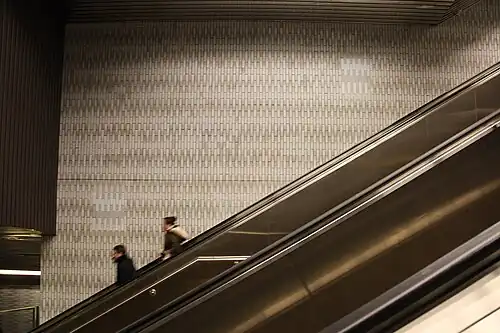 This long escalator between the mezzanine and the headhouse is necessary as the station is deep enough to pass under the East River.