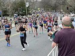 Runners at the intersection of Commonwealth Avenue and Walnut Street in Newton, Massachusetts