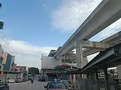 View of the elevated guideway and station from the SS15 Courtyard