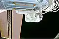 Tanner on the final spacewalk of the mission on 7 December 2000. Part of the new solar arrays can be seen on the left.