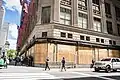 Private security guards, barbed wire fencing, and boarded up windows to prevent looting of department stores in New York City during mass unrest in the United States, 7 June 2020