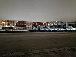 Flatcars with Holiday Train decorations at 4th & Townsend