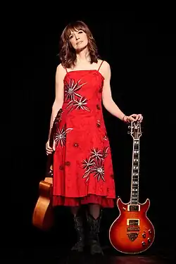 McQuaid with two guitars