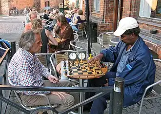 Two men play chess at the Ariman cafe in Lund in 2007.