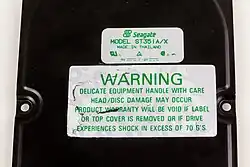 Warranty label on top of a hard disk