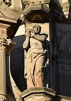 Semi-nude female figure holding an urn over her shoulder, floor 5, bay 5, Princes Street façade