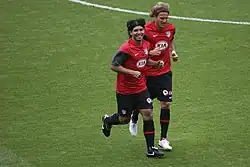 Teammates Sergio Agüero and Diego Forlán training at the Emirates Stadium side by side.
