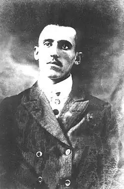 Portrait photograph of Simon Radowitzky, wearing a suit and short dark hair