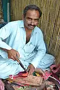Sindhi man making Sindhi Khusso