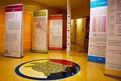 Five 7-foot tall free-standing exhibit panels set up around a room