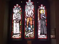 St. Thomas Aquinas Church stained glass windows of Óscar Romero, Pier Giorgio Frassati and André Bessette, Toronto Canada.