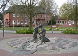 The town hall with a sculpture Jan und Gret symbolising the hard work of coastal fishermen before the onset of tourism[1]