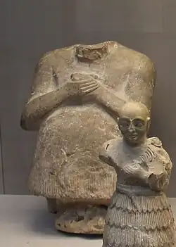 Statue of Iku-Shamash, King of Mari c. 2400 BC (in the rear)