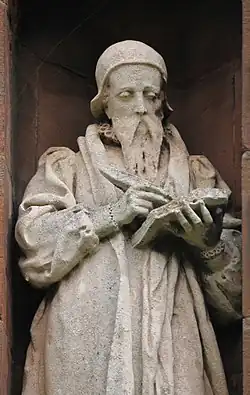 Statue of John Davies on the Translators' Memorial in the churchyard of St Asaph Cathedral