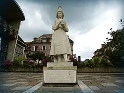 Statue of Marie Harel in white stone