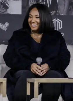 Photograph of director Stella Meghie sitting at an event in 2020.