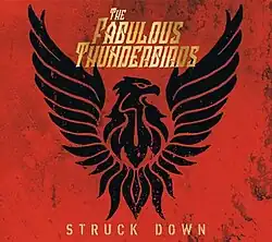 Stylized image of a black thunderbird on a red background