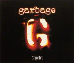 A stylized "G" resembling a branding iron. Above is "Garbage" in neon-like letters, and below "Stupid Girl".