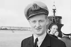 Unruffled's Second Lieutenant Oliver Lascelles pictured in front of the boat on 4 February 1943; Lascelles would go on to command Unruffled later in his career