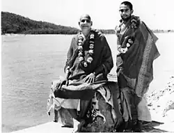 Sivananda and Vishnudevananda by the Ganges, c. 1950
