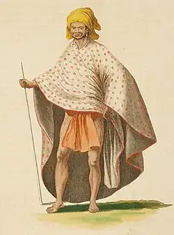 A Tahitian man wearing a shawl and a head wrap.