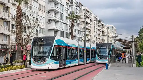 Two trams at the Atatürk Spor Salonu stop of the Konak Line