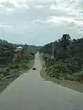 The highway near Aring, towards the border with Terengganu. Taken prior to widening.