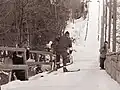 An athlete about to descend the inrun in Planica, 1960