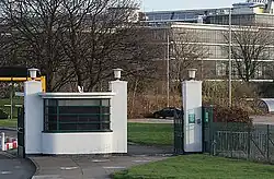 Entrance gate with the D10 building behind
