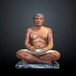The Seated Scribe; 2613–2494 BC; painted limestone and inlaid quartz; height: 53.7 cm; Louvre