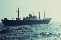 And now astern, the dipped stern flag and the house flag at the top of the mainmast