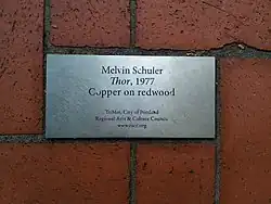 Metal plaque set in brick pavers