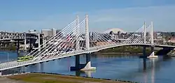 Top: A Type 2 Blue Line train crossing the Steel Bridge Bottom: A MAX train and a Portland Streetcar tram on Tilikum Crossing
