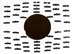 T = 4.2 K, B = 8 mT (80 G). Tin is in the normally conducting state. The compass needles indicate that magnetic flux permeates the cylinder.