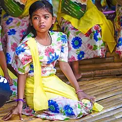 Visayan girl wearing baro't saya while performing Tinikling.