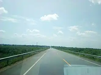 Tirinyi Mbale Highway with blue Sky covered in spotted clouds in Buembatya District