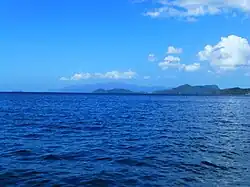 Image 39Monos (front) and Chacachacare (back). Venezuelan mainland (Paria Peninsula) seen in the horizon and Patos Island seen to the left. (from List of islands of Trinidad and Tobago)