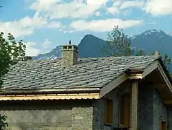 Image 28Alpine chalet being built in Haute-Maurienne (Savoy). The use of thick pieces of orthogneiss (4–7 cm) is by the strict architectural regulations in the region bordering the national parks of Vanoise-Grand Paradis. (from Alps)