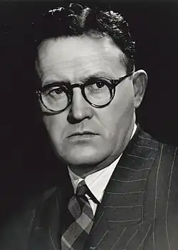 Black-and-white photograph of Tom Burke