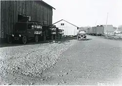 Trucks loaded with celery arriving at a loading station in preparation for being loaded into railroad cars, Lake Labish area near Brooks, Oregon