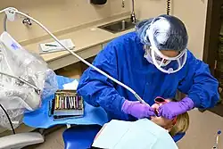 A U.S. Air Force dental technician from the 28th Medical Group cleans a child's teeth at Ellsworth Air Force Base, South Dakota, March 2023.