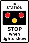 Fire station ahead, STOP when lights show. "FIRE" may be varied to "AMBULANCE"