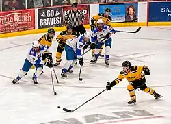 Marauders Hockey player races for the puck