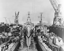 USS Claxton (DD-571), USS Canberra (CA-70) and USS Killen (DD-593) in floating dry dock ABSD-2 on 2 December 1944