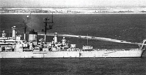 USS Newport News firing on North Vietnamese positions during the Vietnam War in May 1972.